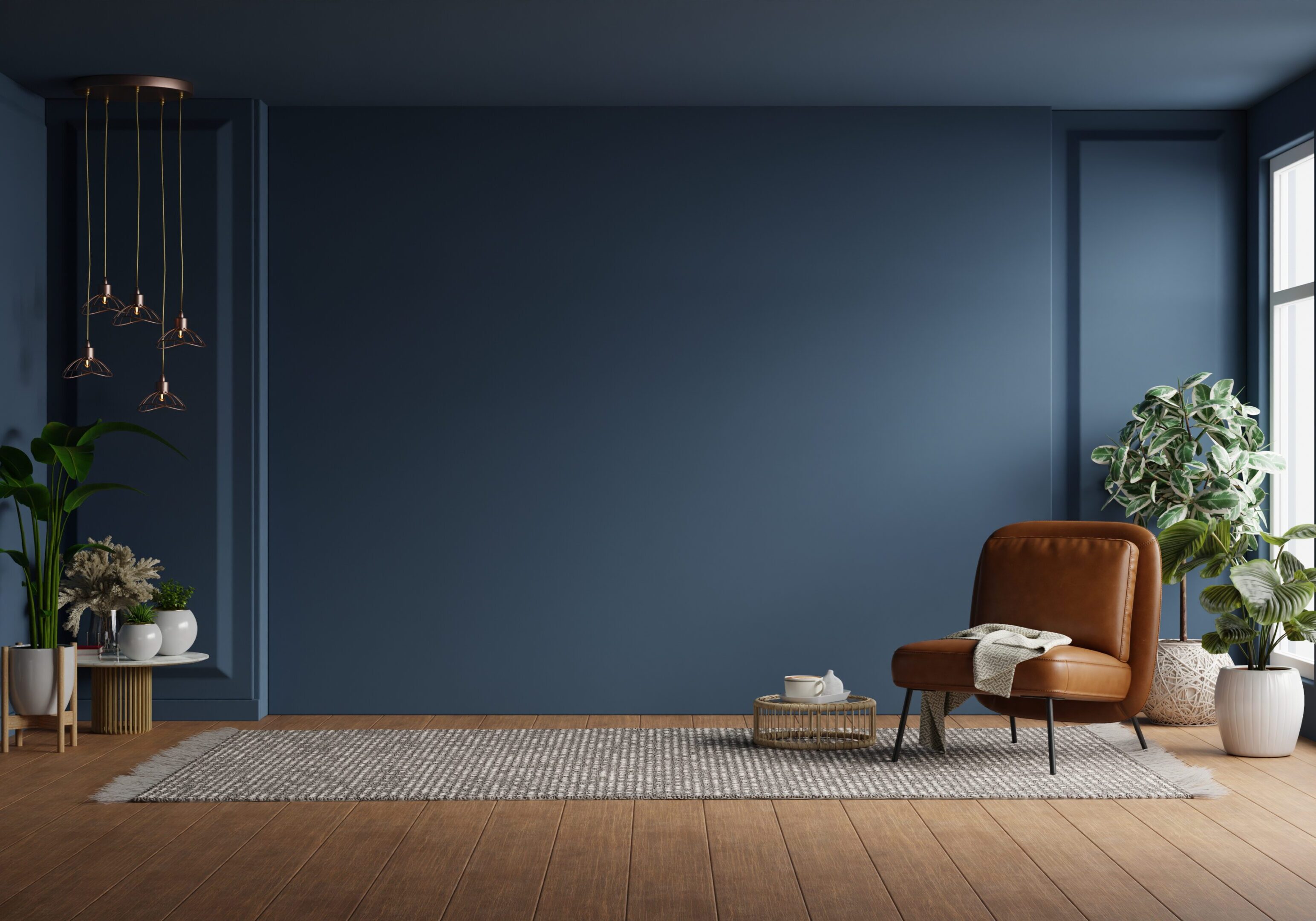 Modern interior of living room with leather armchair on wood flooring and dark blue wall- 3D rendering